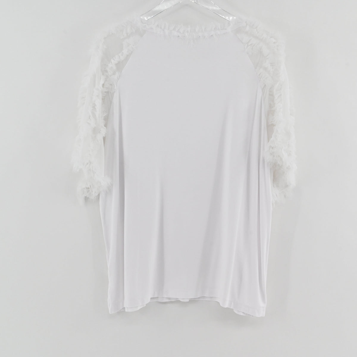 Lynn's Closet Boutique Kobi Halperin white top featuring textured ruffle sleeves and neckline on a hanger