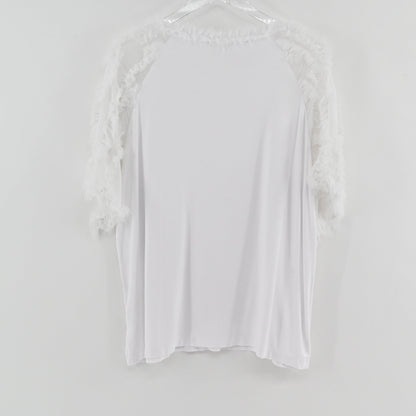 Lynn's Closet Boutique Kobi Halperin white top featuring textured ruffle sleeves and neckline on a hanger