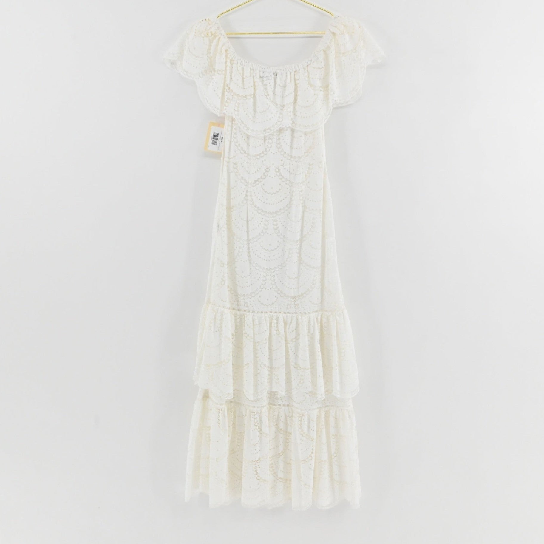 Lynn's Closet Boutique Gianni Bini white midi dress with off-the-shoulder ruffled neckline and tiered scalloped lace
