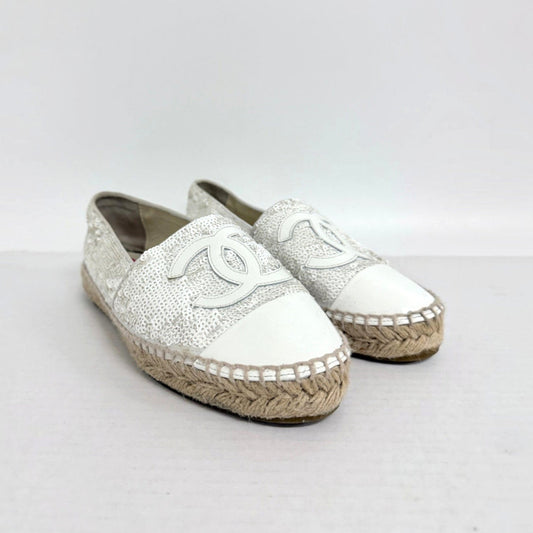 Lynn's Closet Boutique white sequin Chanel espadrilles with CC logo, leather toe cap, and traditional jute sole.