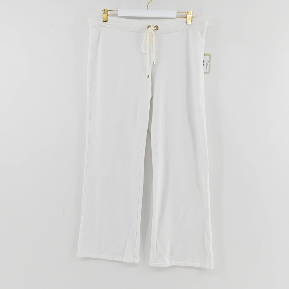 Lynn's Closet Boutique white textured wide-leg pants by Lilly Pulitzer with an elastic drawstring waist and gold accents.