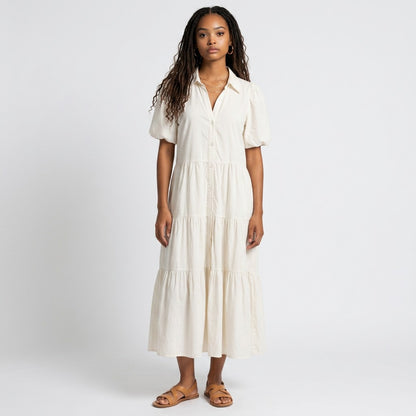 Lynn's Closet Boutique Brochu Walker white tiered midi dress with a collar and puff sleeves worn by a model