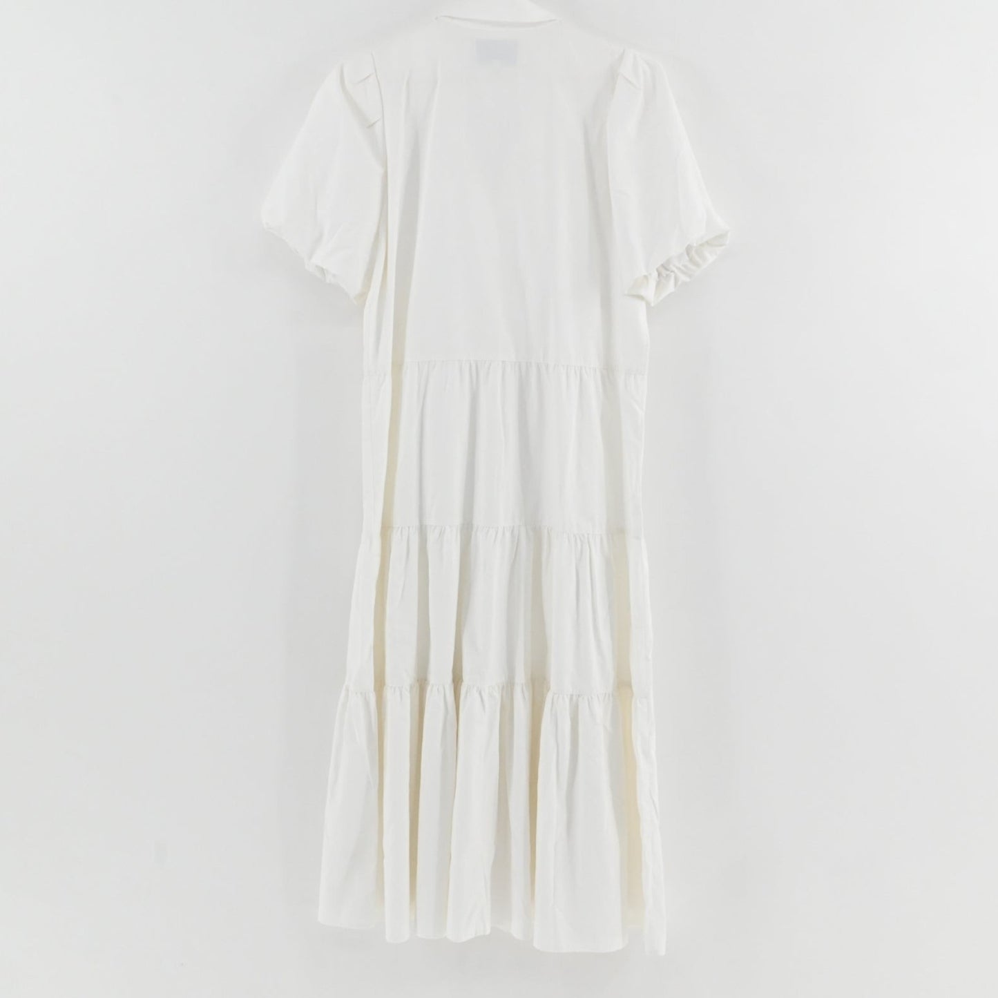 Lynn's Closet Boutique white midi tiered dress with puff sleeves and collared neckline, back view.