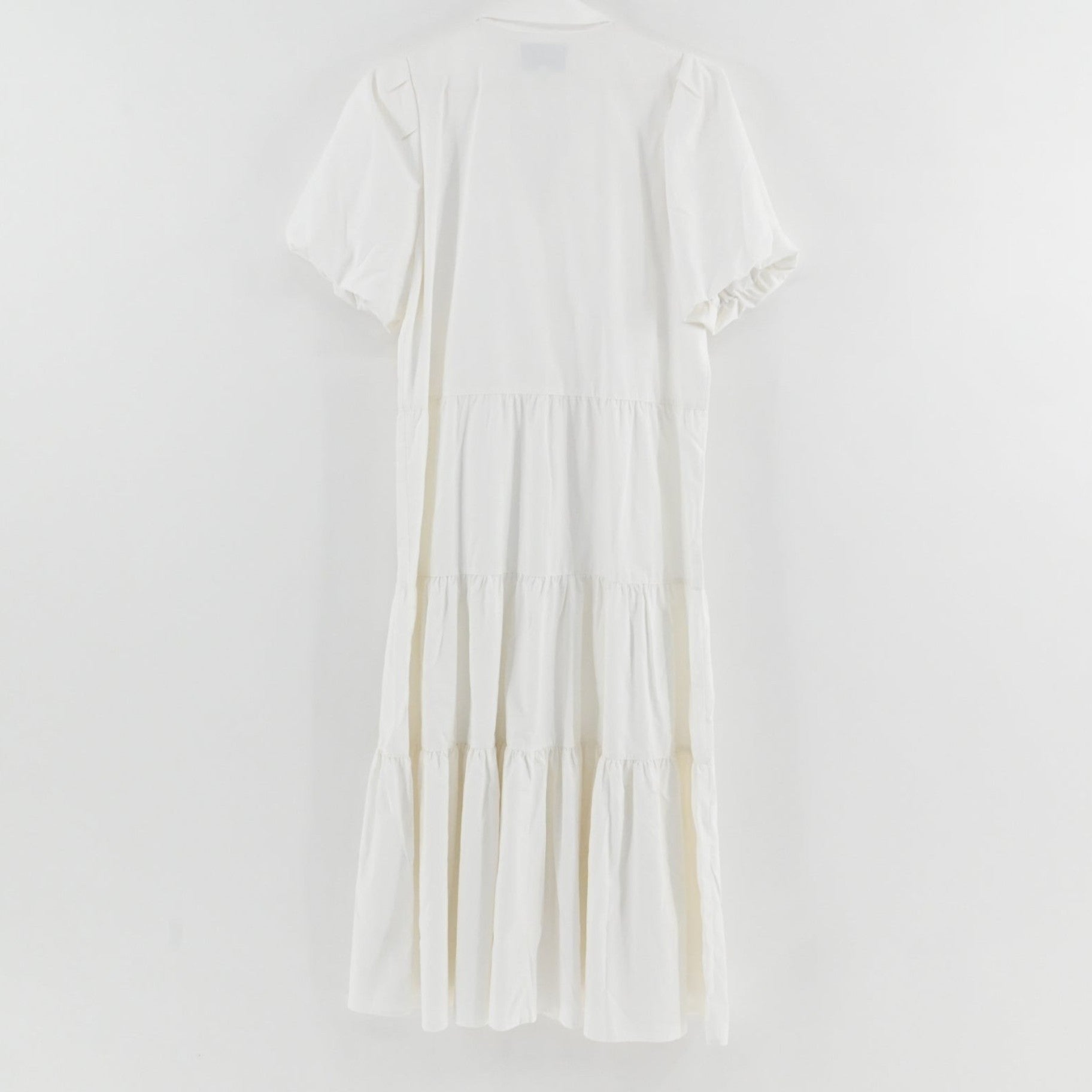 Lynn's Closet Boutique white midi tiered dress with puff sleeves and collared neckline, back view.