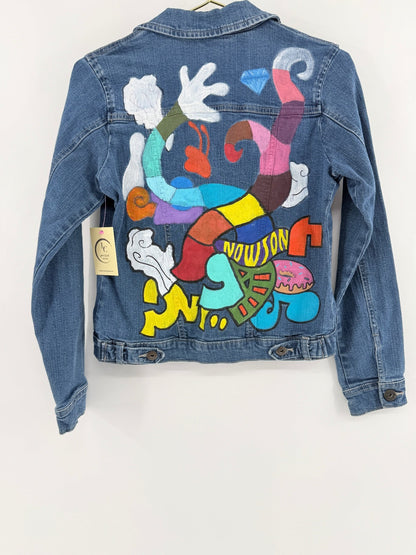 Lynn's Closet Boutique vintage Wrangler denim jacket featuring colorful hand-painted abstract cartoon art on the back