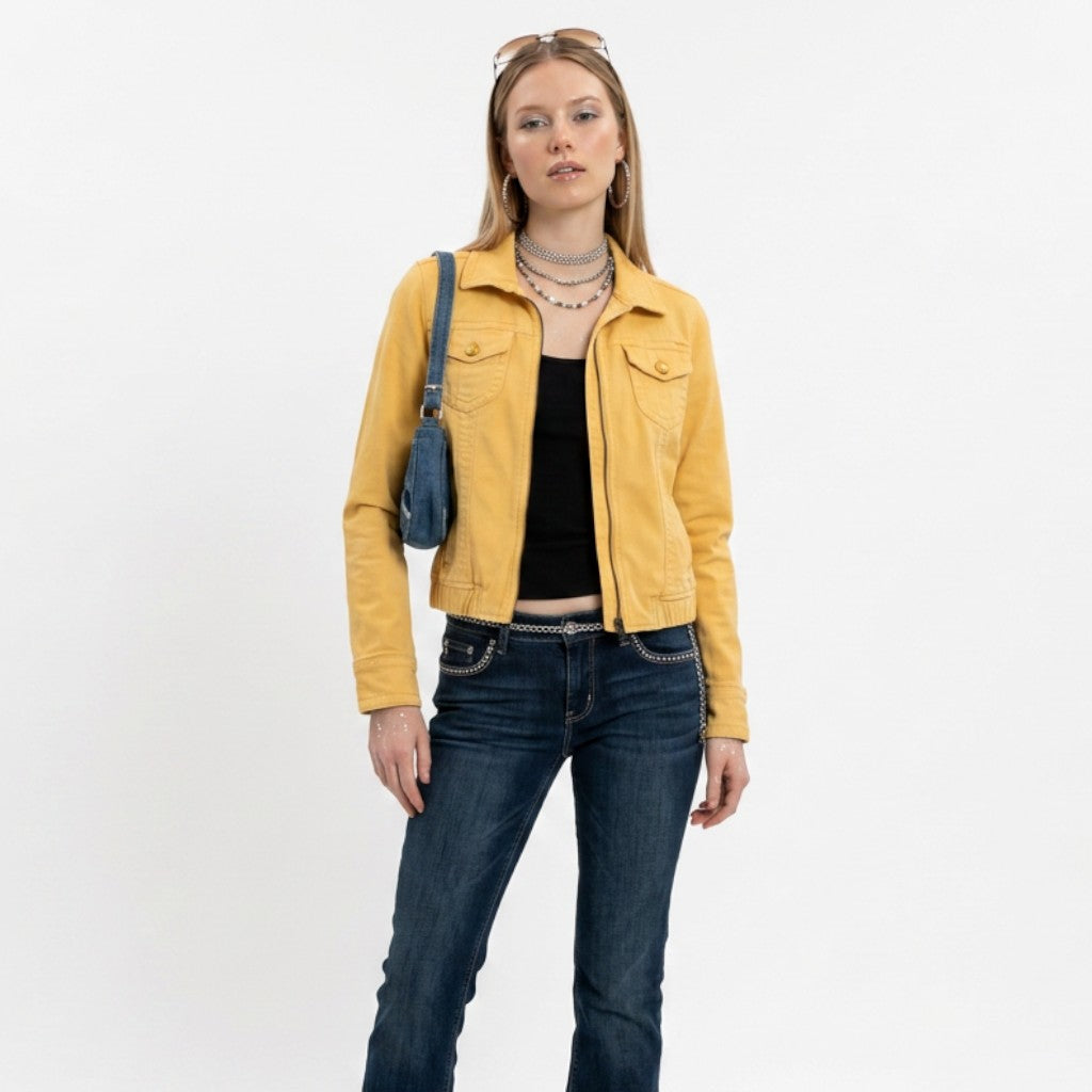 Model wearing a yellow American Eagle zip-up trucker jacket from Lynn's Closet Boutique with dark blue jeans