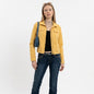 Model wearing a yellow American Eagle zip-up trucker jacket from Lynn's Closet Boutique with dark blue jeans