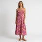 Model wearing a Lynn's Closet Boutique Z Supply purple and orange floral midi dress with a smocked bodice and ruffles.