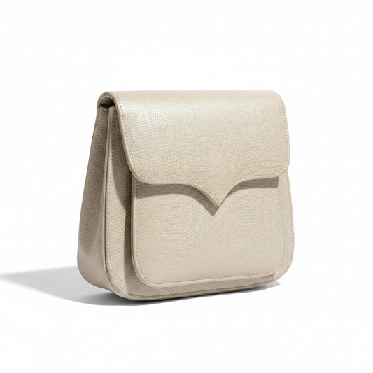 Lynn's Closet Boutique vintage 70s/80s beige pebbled leather crossbody bag with flap closure.
