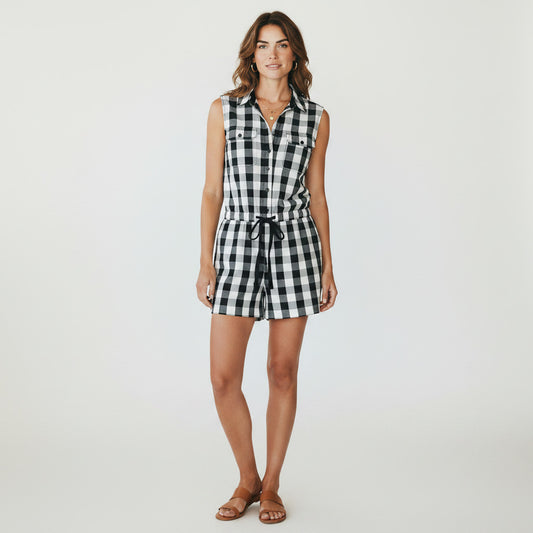 Lynn's Closet Boutique black and white checkered sleeveless romper with drawstring waist and button-up front.