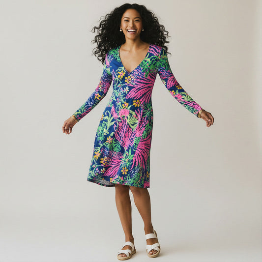 Lynn's Closet Boutique navy blue long sleeve v-neck dress with a vibrant pink, green, and yellow floral and palm leaf print. Size L.