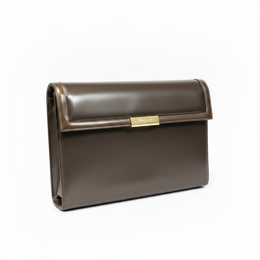 Lynn's Closet Boutique vintage 80's Salvatore Ferragamo bronze leather clutch with gold hardware and a flap closure.