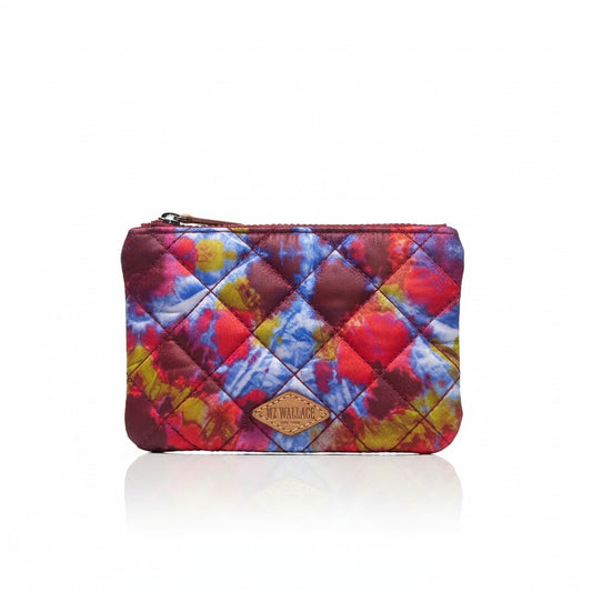 Lynn's Closet Boutique MZ Wallace tie-dye quilted zip pouch with red, blue, yellow, and pink abstract pattern. Features a leather logo patch.