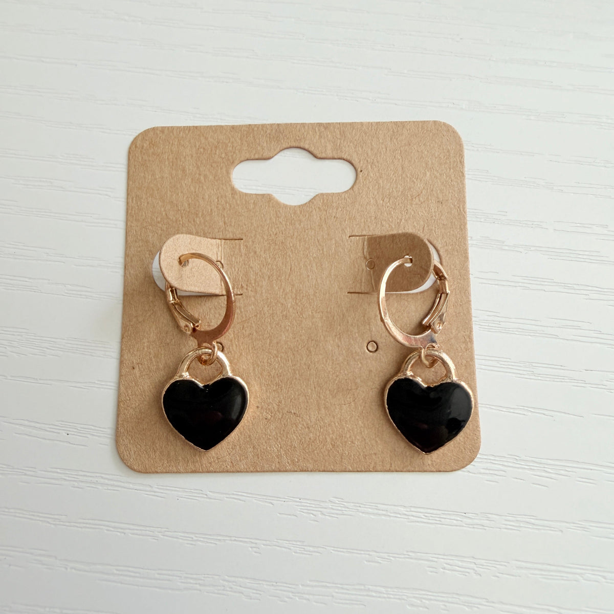 Gold black enamel heart drop earrings