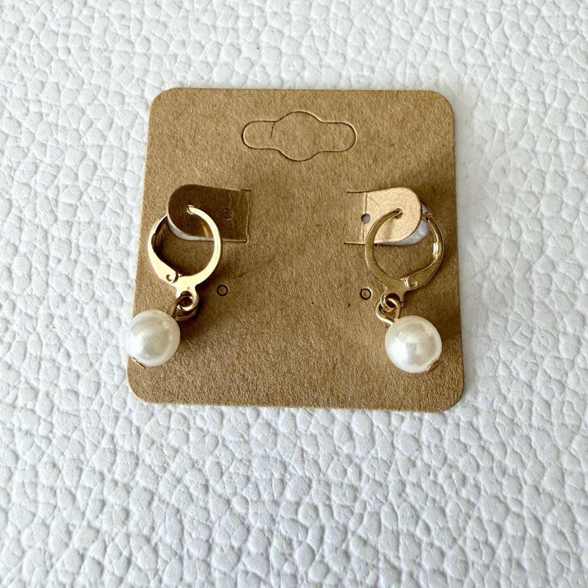 Gold pearl drop huggie earrings